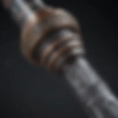 Close-up of a lightsaber hilt highlighting intricate details and customization options